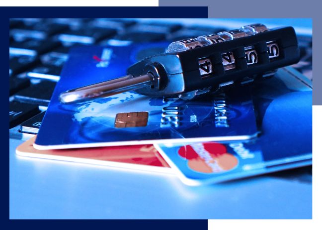 Identity fraud: A padlock placed on top of bank cards and a keyboard to depict online identity fraud.