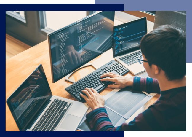 Person working on numerous devices.
